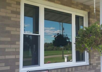 exterior pictures of triple windows with grids on top only
